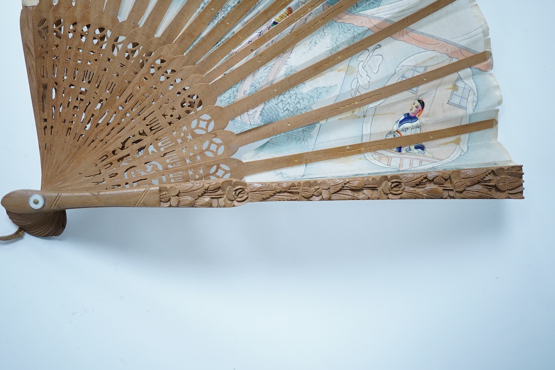 A collection of 19th century and later fans to include a black lacquered and lace example and a hand painted floral example